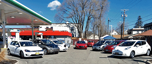 ABB's DC fast charger, nestled behind a handful of the many electric vehicles it served during the 24 Hour EV Charging Challenge